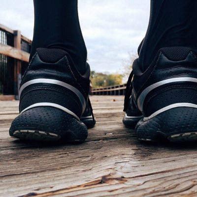 A performance trail running shoe with visible rock-plate sole